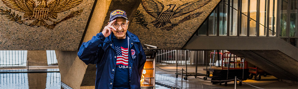 Veteran in front of Memorial